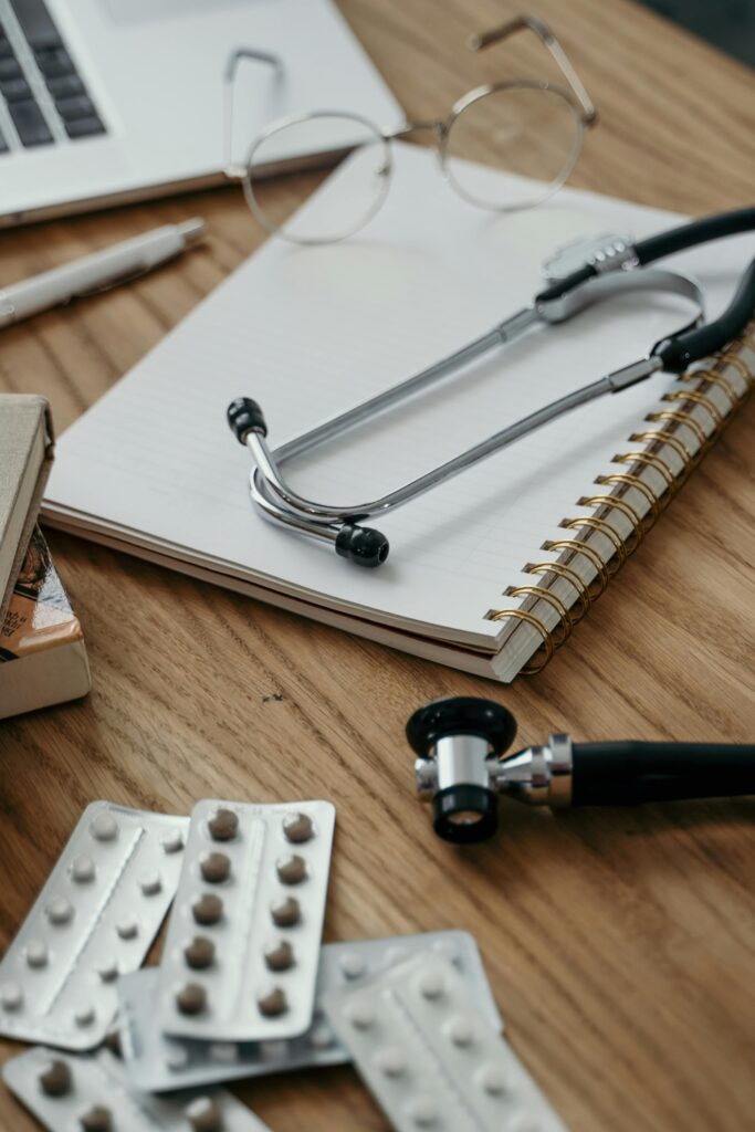 Stethoscope and Notebook on Desk